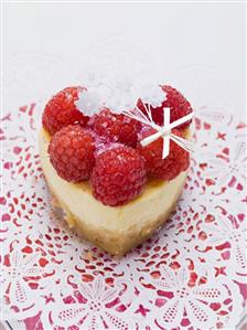 Heart-shaped quark cake with raspberries