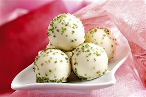 Pistachio truffles in a dish