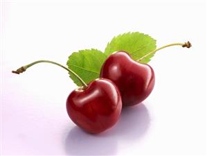 Two cherries with leaves