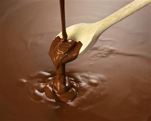 Melted chocolate with wooden spoon