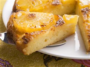 Pineapple upside-down cake, a piece cut