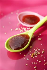 Strawberry coulis in two spoons