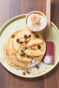 Apple pancakes with yoghurt and crushed praline