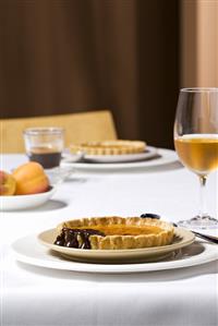 Apricot tarts with chocolate sauce