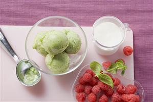 Kiwi fruit ice cream and fresh raspberries