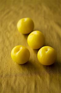 Four yellow plums