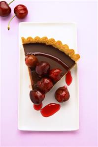 A piece of chocolate cherry tart from above