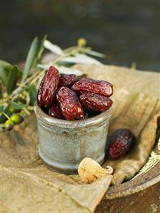 Dried dates in ceramic pot