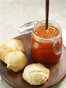 Scones and a jar of orange marmalade