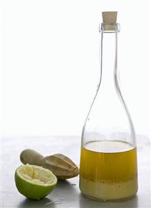 Vinaigrette in bottle, squeezed lime, citrus reamer