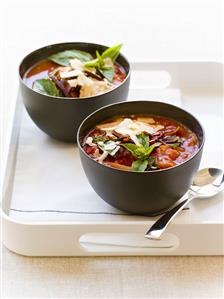 Tomato soup with basil in two bowls