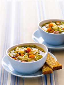 Vegetable soup with pasta and bacon
