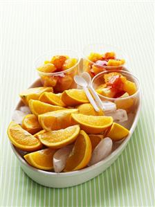 Orange wedges with strawberry sauce