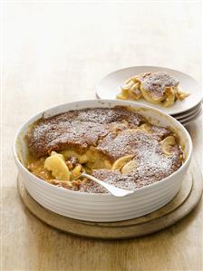 Apple pudding sprinkled with icing sugar