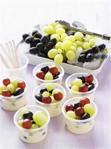 Grape dessert in plastic tubs