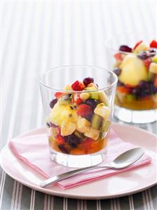 Fruit salad with ice cream in glasses