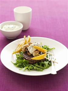 Beefsteak with lemon and mushroom skewers and yoghurt dip