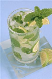 Mojito with lime slices and mint