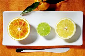 Halves of three different citrus fruits