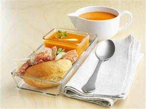 Cream of pumpkin soup with salami roll