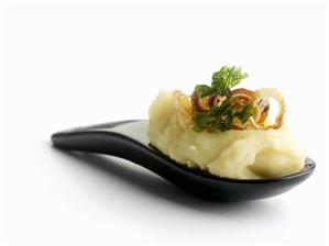 Lemon mashed potatoes with deep-fried onion & parsley topping