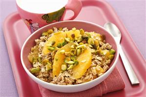 Muesli with pistachios and orange segments