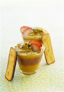 Layered dessert of mango & plum cream with pistachios & toast