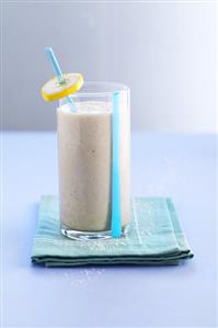 A glass of banana and coconut milk shake