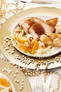 Roast pork with roast potatoes and orange & chicory salad