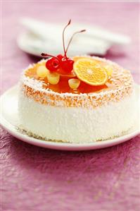 Cheesecake with fruit jelly, coconut and fruit