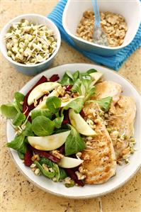 Fried chicken breast with pear and sprout salad