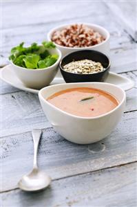 Tomato soup made with coconut milk, sunflower seeds, coriander, rice