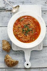 Tomato soup with lentils, couscous and chilli