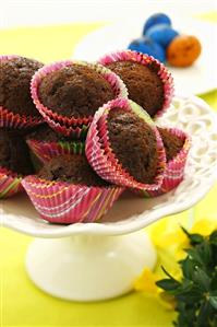 Chocolate muffins in coloured paper cases