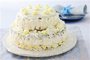 Cake with mascarpone cream and white chocolate icing