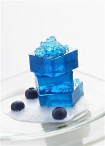 Molecular gastronomy: blueberry jelly on lychee foam