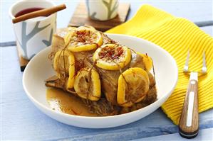 Roast pork with lemon slices and saffron