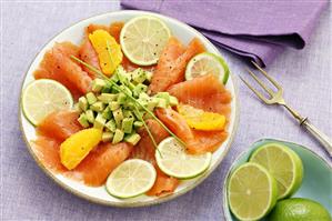 Smoked salmon with avocado, lime slices & orange segments