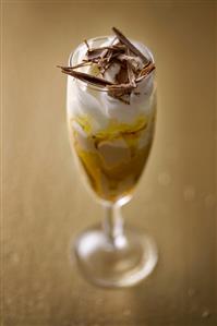 Ice cream sundae with cream and chocolate shavings