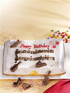 Birthday cake with chocolate musical instruments