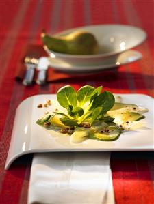 Avocado carpaccio with corn salad and pine nuts