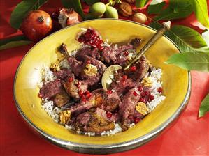 Braised duck in pomegranate and walnut sauce on rice