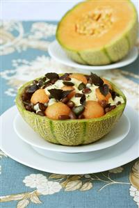 Bean & melon salad with pumpkin seeds in hollowed-out melon