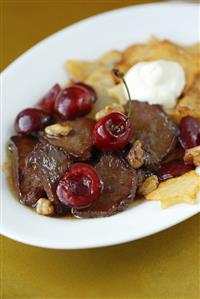 Venison ragout with cherries and nuts