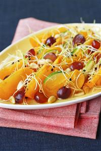 Fruit salad with sprouts and pine nuts