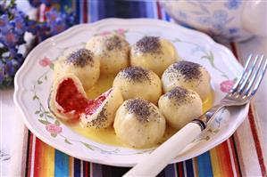 Sweet dumplings with berry filling and poppy seeds