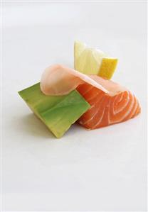 Salmon sashimi with pickled ginger, avocado, lemon