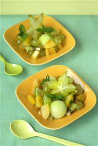 Fruit salad: melon, grapes, kiwi fruit and caramabolas