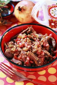 Duck goulash with pomegranate seeds