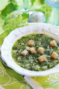 Herb soup with croutons for Easter